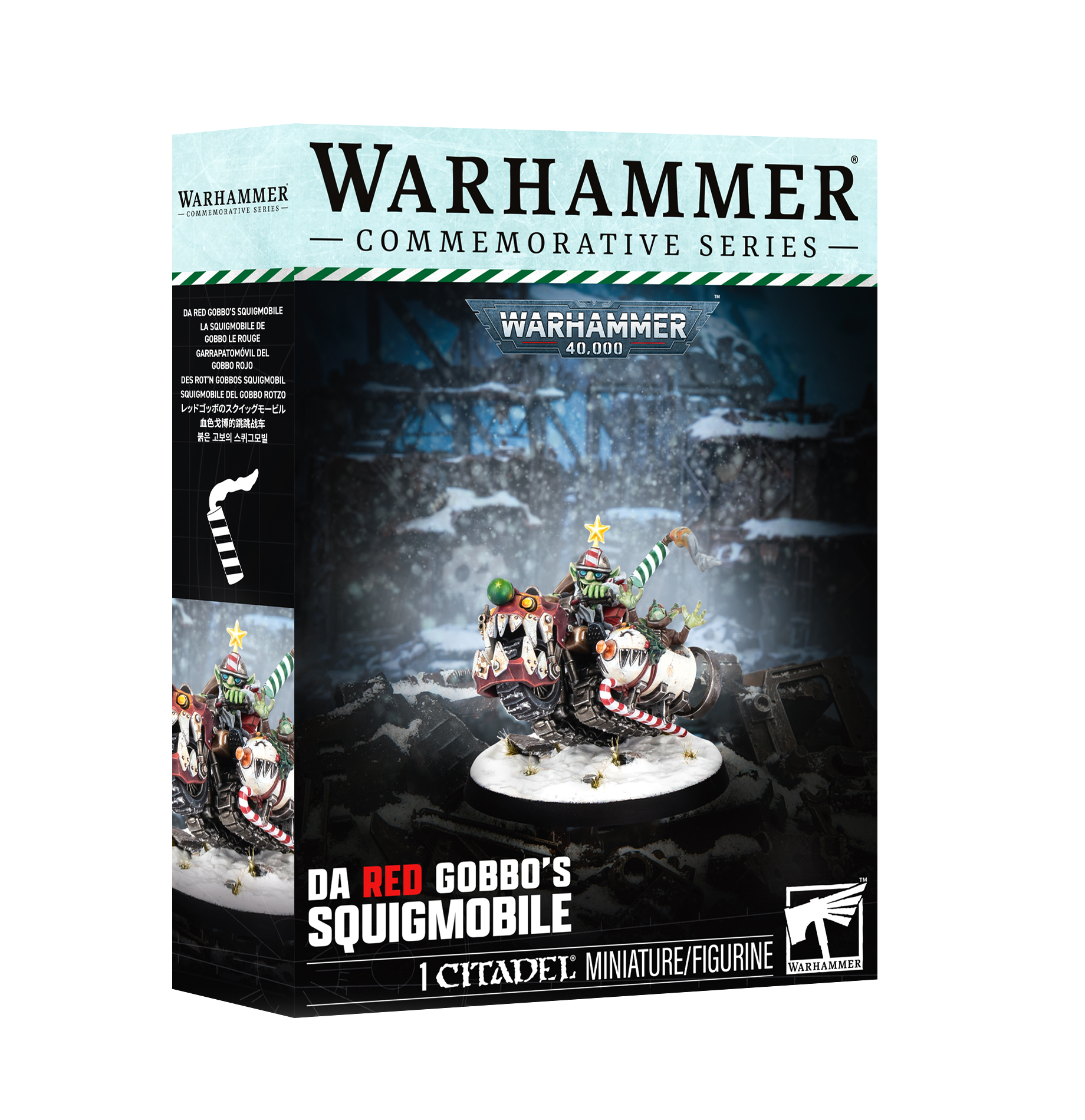 front of box featuring painted miniature of goblin in red driving a snowmobile with red and green metal face and smaller goblin in a snow man themed side car