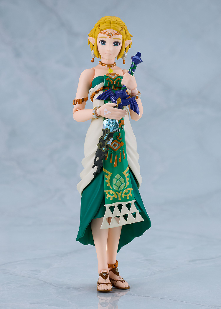 articulated zelda action figure with short hair and white and green dress holding master sword