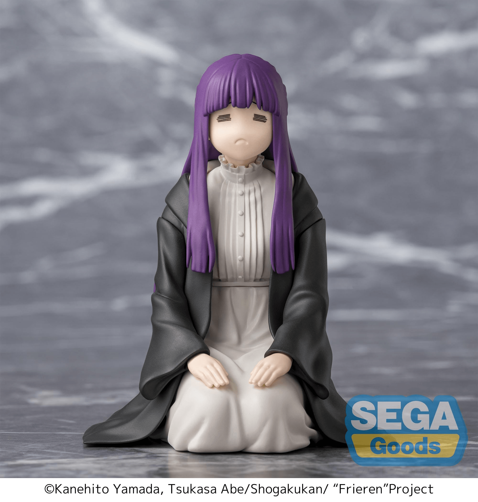 figure of woman with pruple hair and black cloak kneeling with pouting facial expression