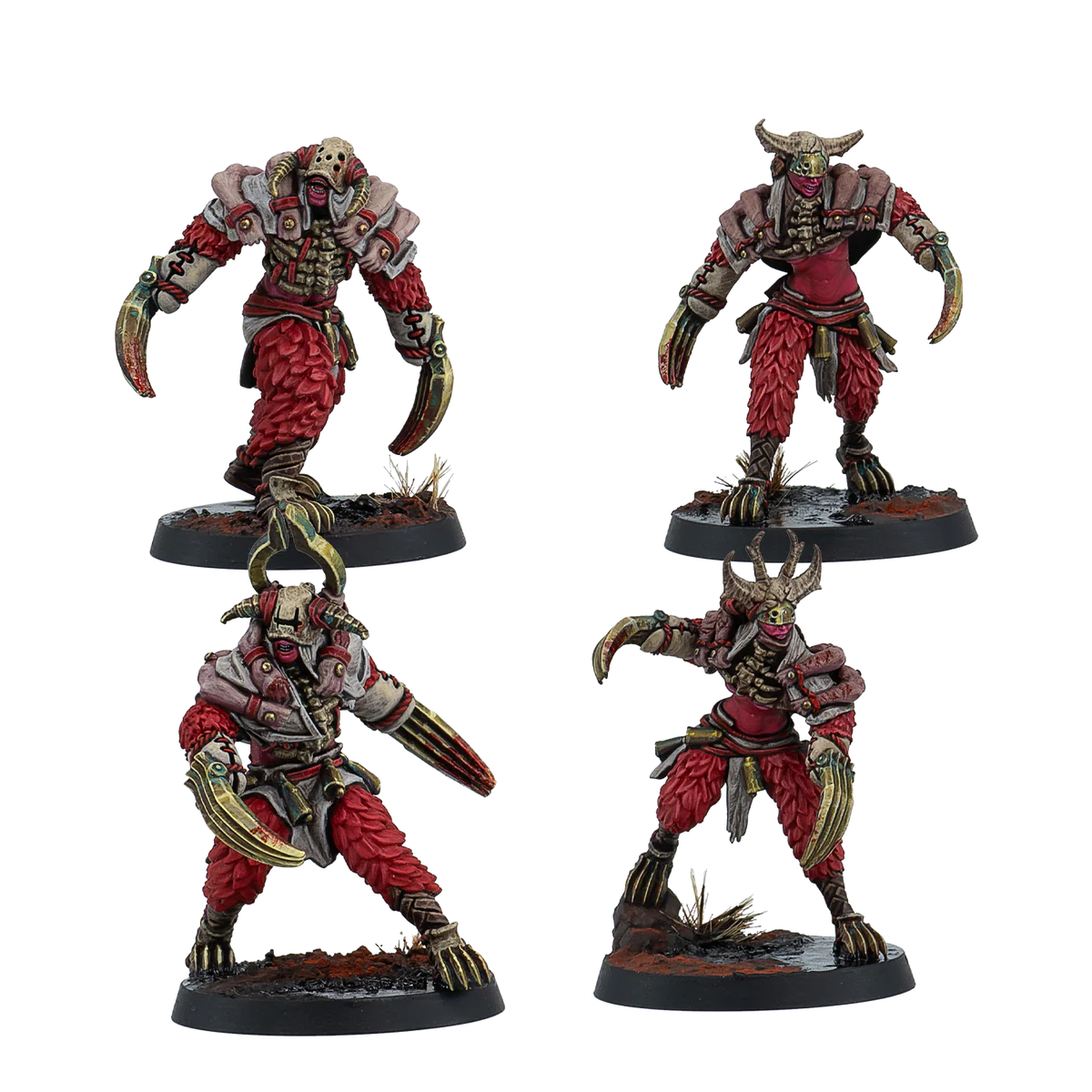 four painted miniatures with red skin and fur clothes