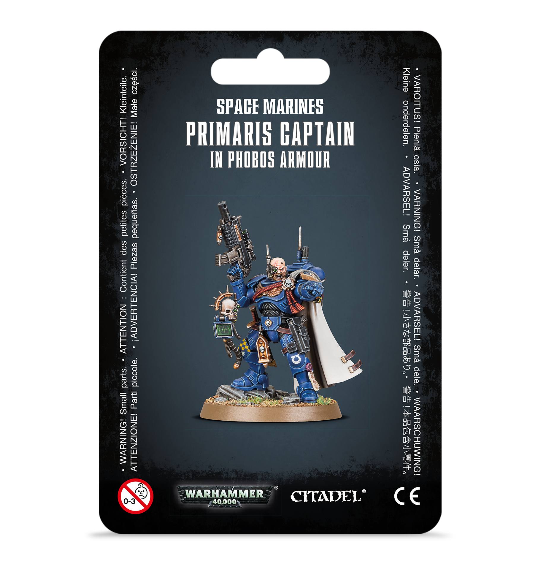 front of box featuring bald space marine in blue power armor