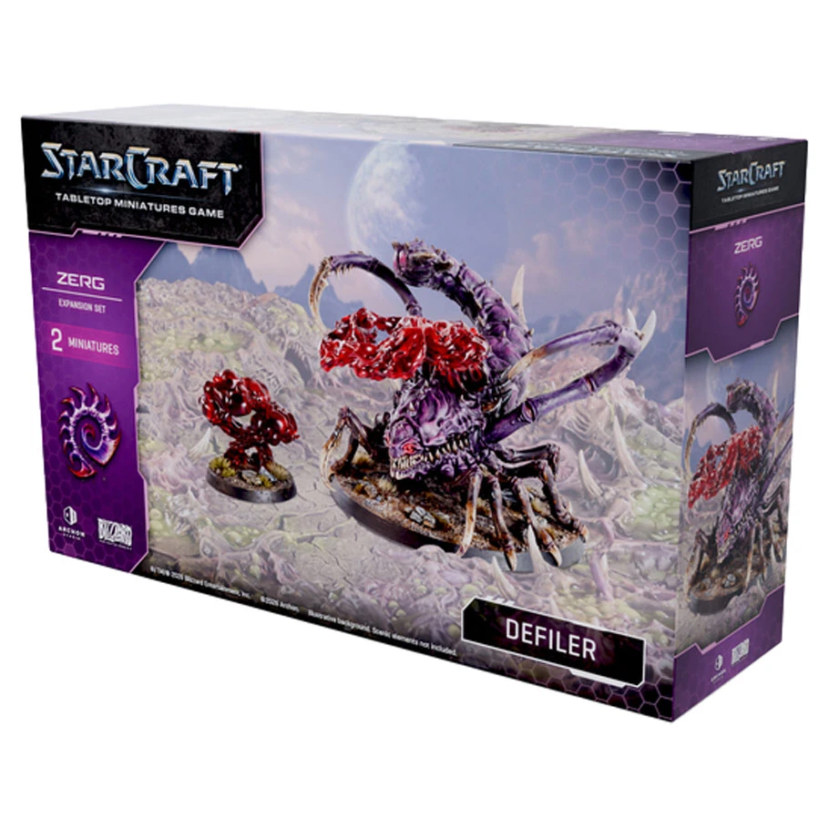 front of box featuring one purple bug alien and one red floating goo miniature