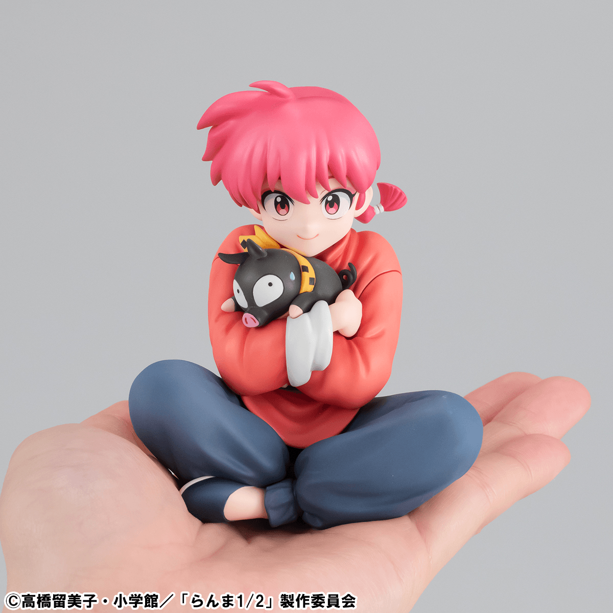 small ranma saotome figure held in palm