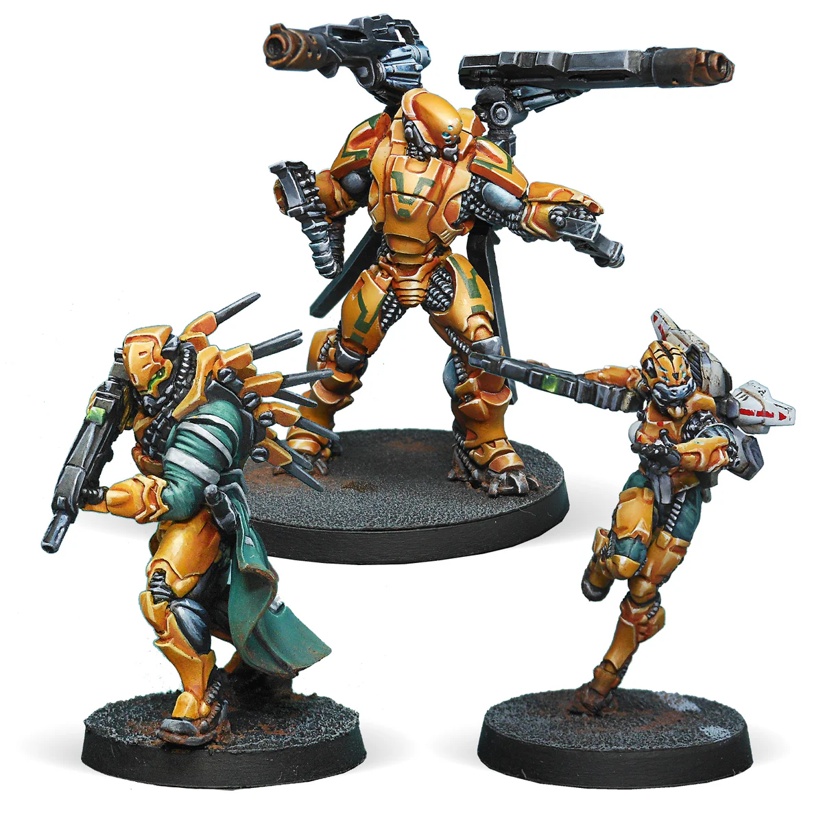 three painted orange, green, and black miniatures