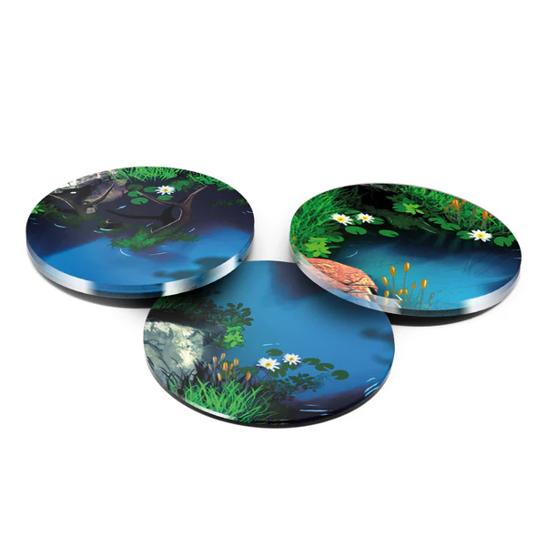 three round tokens with pond art