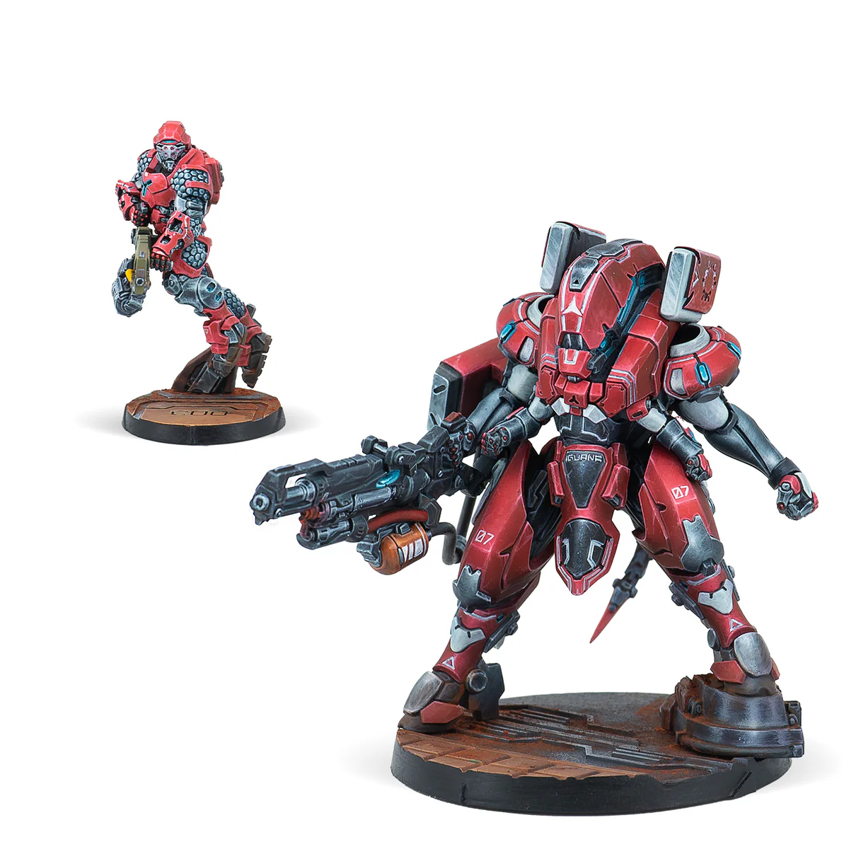 two painted red and white science fiction miniatures