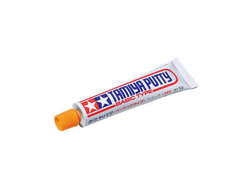 white toothpaste type tube with tamiya logo and orange cap